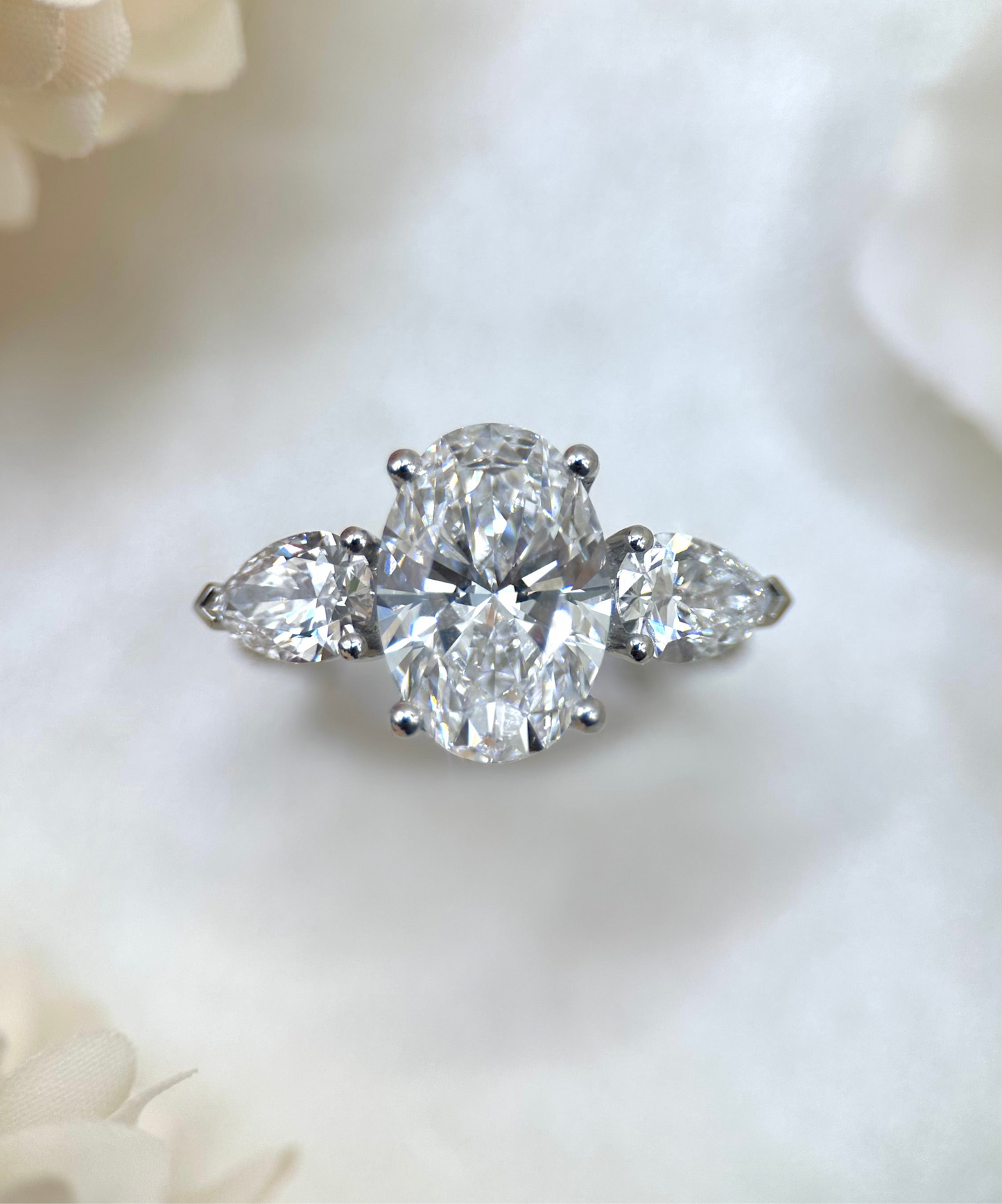 Oval and Pear Diamond Trilogy Engagement Ring